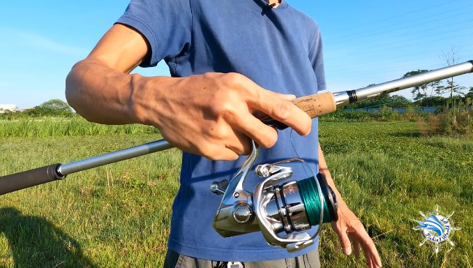 Pose to prepare for casting a spinning reel